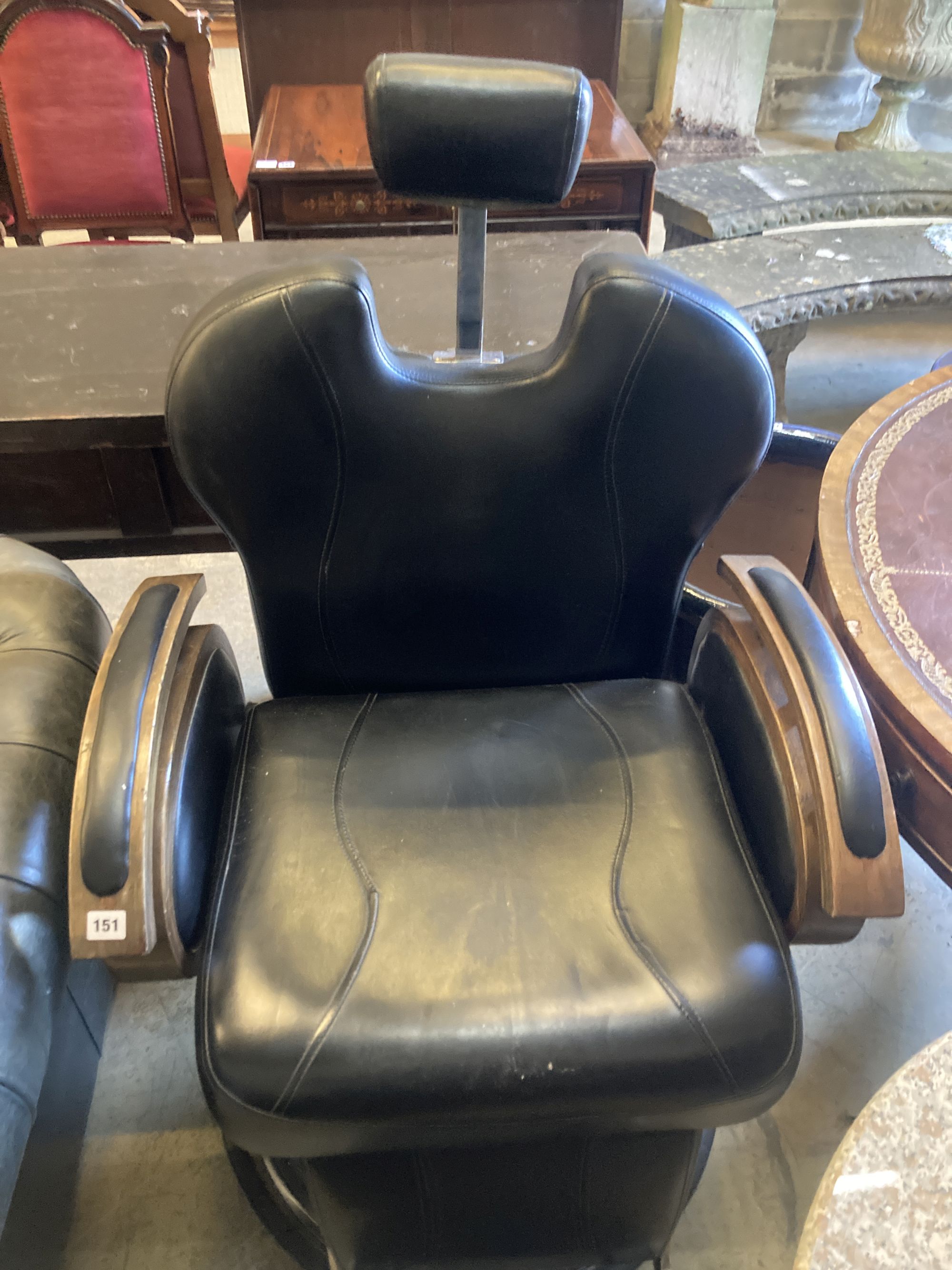 A black leatherette adjustable barbers chair, width 70cm, height 120cm